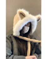 Close-up of a beige fox ears hat with a hood, featuring plush fur ears and a warm lining.
