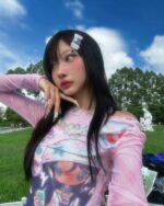 Retro pink cutecore top with a colorful graphic print, long sleeves.