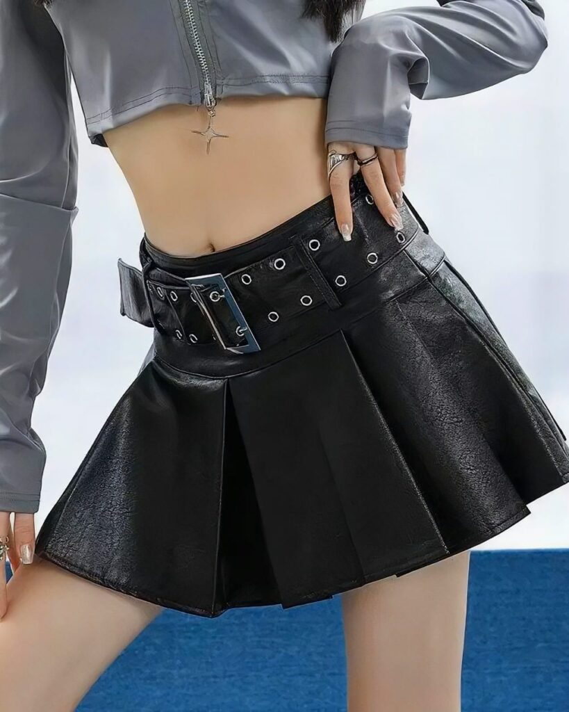 Black vegan leather punk skirt with multiple buckles and pleats, gothic style.