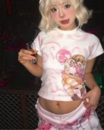 Short pink cutecore aesthetic tee with anime-style illustration.
