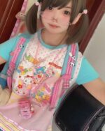 Woman wearing a Kawaii Pastel Mezzo Piano T-Shirt - Yume Kawaii Aesthetic with a layered outfit.