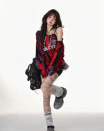 Red and black coquette aesthetic sweatshirt worn by a model with sporty details and sneakers.