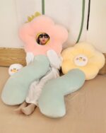 Kawaii angry flower plushie pillows with removable head, one pink and one blue.