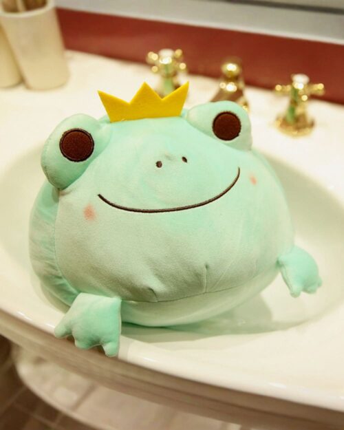 Kero the Queen and King Frog Plushie, a cute teal frog prince plushie in a sink.