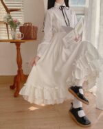 White gothic lolita ruffled skirt with high waist, worn by a model.