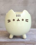Cute pusheen flower pot, a ceramic planter shaped like the character.