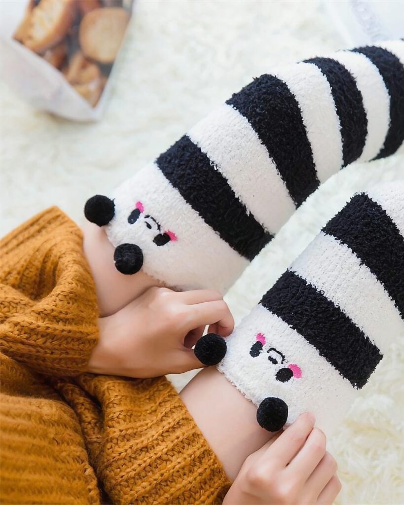 Winter Long Fluffy Socks - Animals Edition kawaii fluffy socks with black and white panda design and pom poms.