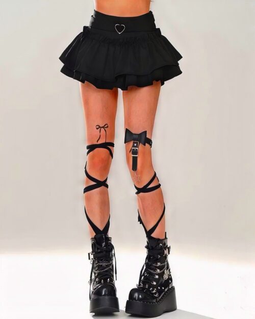 Black kawaii lolita skirt with layered ruffles, bow tie, and knee accents.