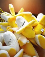 Pile of kawaii chibi banana plushies, perfect as a fruit keychain.
