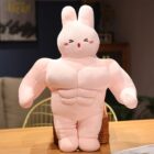Pink buff bunny plushie with visible musculature, soft fabric material.