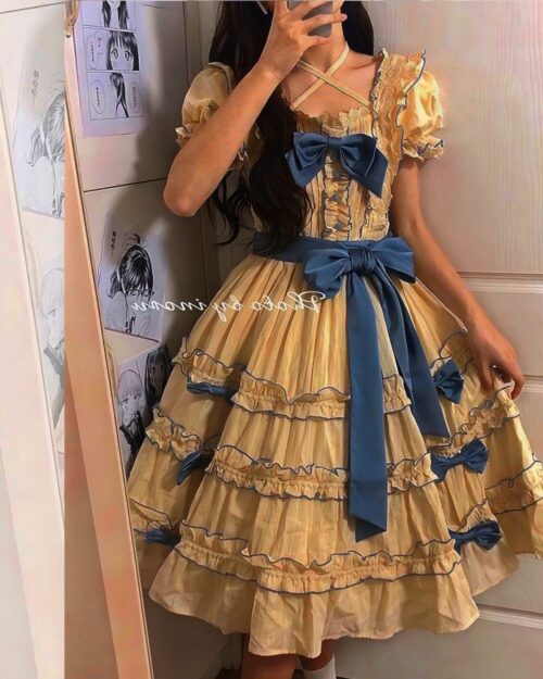 Yellow ruffled french lolita dress with blue ribbon trim and sleeves.