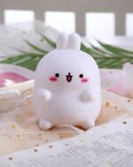 Kawaii Molang bunny lamp, a cute silicone night light with pink details and white fur.