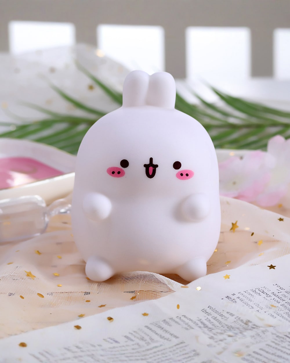 Kawaii Molang bunny lamp, a cute silicone night light with pink details and white fur.