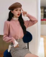 Pink french aesthetic top with ruffled sleeves and high neckline, vintage style.