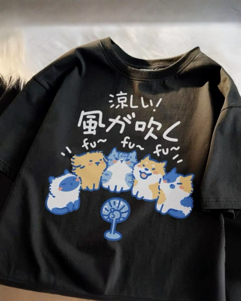 Black cat and dog tee graphic featuring cartoon pets and a fan.