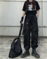 Black detached y2k aesthetic pants with multiple straps and pockets.