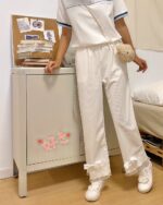 White Laced Casual Pants with bows, a charming kawaii clothing item.