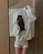 Person wearing fluffy bunny pajamas, soft girl aesthetic loungewear.