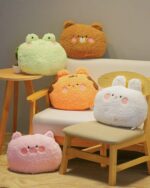 Set of kawaii animal plushie cushions in various colors and designs, including bear, frog, pig, and rabbit.