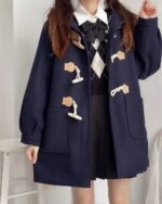 Dark blue kawaii woolen coat with teddy bear appliques and a hood.