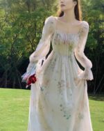 Elegant French Floral Dress - Retro Aesthetic, featuring a long-sleeved, floral print gown in a light beige color.