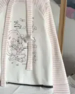 White nyanko pink t-shirt with cute character illustrations and pink stripes.