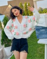 White vintage aesthetic cardigan with floral embroidery detail featuring roses.
