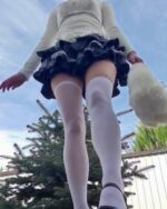 Y2k Lolita Set featuring a white top, black ruffled skirt, and thigh-high socks.