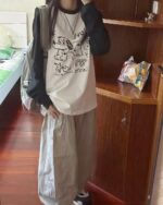 Long sleeve dog doodle t-shirt featuring playful dog drawings.