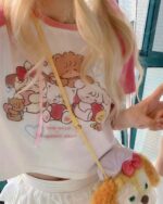 Cute summer pink harajuku aesthetic t-shirt featuring illustrated animals and floral details.