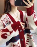 Vintage cat cardigan sweater featuring a charming pattern design.