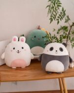 Set of squishy animal plushies: bunny, panda, and tamagotchi.