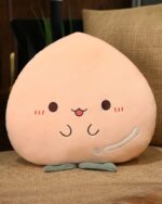 Kawaii fruit plushie cushion featuring a peach-shaped plush toy with facial details.