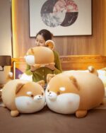 Extra Chonky Shiba Inu Plush on a bed, soft and cuddly toy.