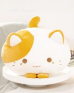 Kawaii cat plushie, a soft, white and yellow plush toy with rounded features and ears.