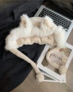 Close-up of a fluffy fox ears hat, soft faux fur design.