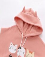Pink neko pullover hoodie with cat illustrations and a hood.