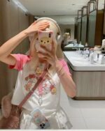 Model wearing a MIKKO Printed Shirt - Harajuku Aesthetic featuring cute animal characters.