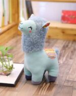 Close-up of a blue Happy Llama Plushie, soft plush toy with a colorful tail.