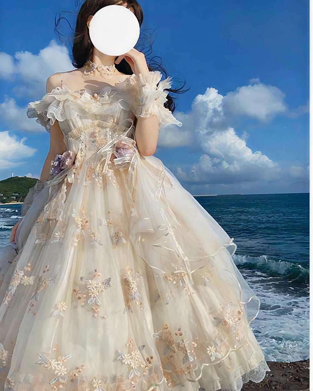 Cream floral lolita dress with ruffles and lace, outdoors by the sea.