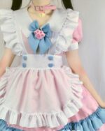 Kawaii Lolita maid dress featuring a white and pink design with ruffles and a blue paw print bow.