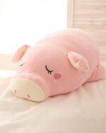 Pink kawaii piggy plushie, soft and cuddly stuffed animal.