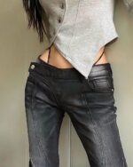 Black low waist y2k jeans, featuring a low rise and detailed stitching. Perfect Y2K style.