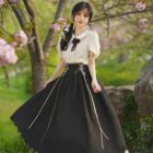 Retro Style Dress - Cottagecore aesthetic dress with a black skirt and puff sleeves, outdoors.