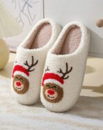 White christmas plushy slippers with reindeer design and faux fur lining.