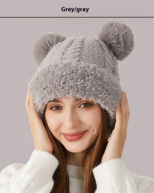 Grey bear ears hat, a warm winter knit hat with fluffy pom-pom accents.
