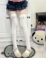 Kawaii kaomoji cute stockings, white knee-highs with emoticon faces, stylish and adorable legwear.