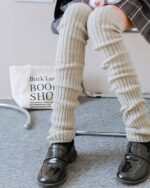 Cream ribbed japanese gyaru socks, knee-high leg warmers, Harajuku style.