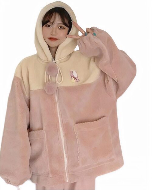 Fluffy kawaii hooded coat featuring a beige and pink sherpa fleece design with pom-poms and embroidery.