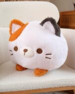 Kawaii neko cat pillow, a plush round cat toy with orange and gray accents.